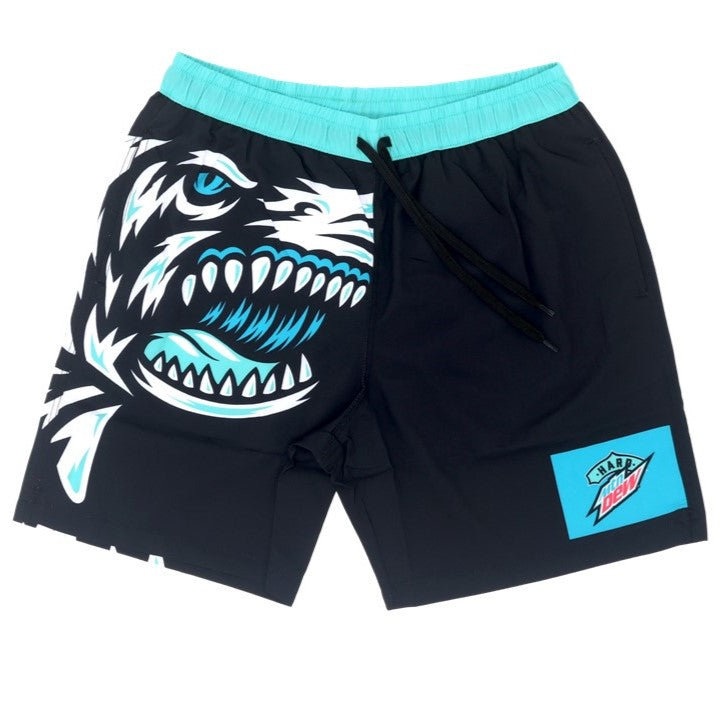 Full front view of swim trunks featuring a detailed illustration of the white and teal shark design on the right leg. On the bottom of the left leg is the teal square logo with the Baja Blast design.