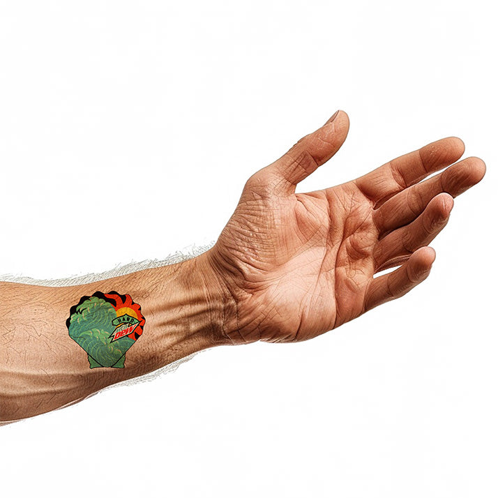 Hard Mountain Dew branding, modeled on the wrist of an arm: Clamshell shape with teal wave and yellow/orange sun, Hard Dew logo over the artwork.